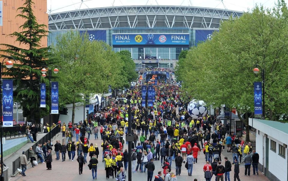 Fans arrive for the UEFA Champions League Final at Wembley Stadium, London.