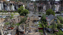 Damaged buildings ruined by attacks are seen in Irpin, on the outskirts of Kyiv, Ukraine, Thursday, May 26, 2022. (AP Photo/Natacha Pisarenko)