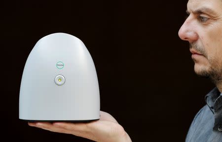 Aryballe Technologies CEO Tristan Rousselle shows a prototype of NeOse, a universal portable odour detection device connected to a database on a mobile phone, in Paris, April 20, 2016. REUTERS/Christian Hartmann