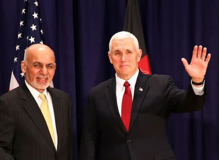 U.S. Vice President Mike Pence poses for a picture with Afghan President Ashraf Ghani before their meeting at the 53rd Munich Security Conference in Munich, Germany, February 18, 2017. REUTERS/Michael Dalder