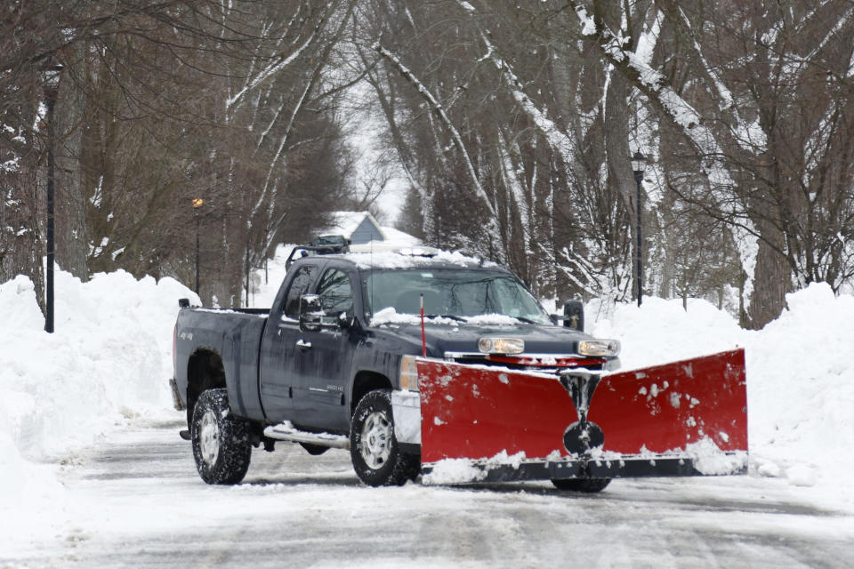 A plow clears snow after a winter storm rolled through Western New York Tuesday, Dec. 27, 2022, in Amherst, N.Y. (AP Photo/Jeffrey T. Barnes)