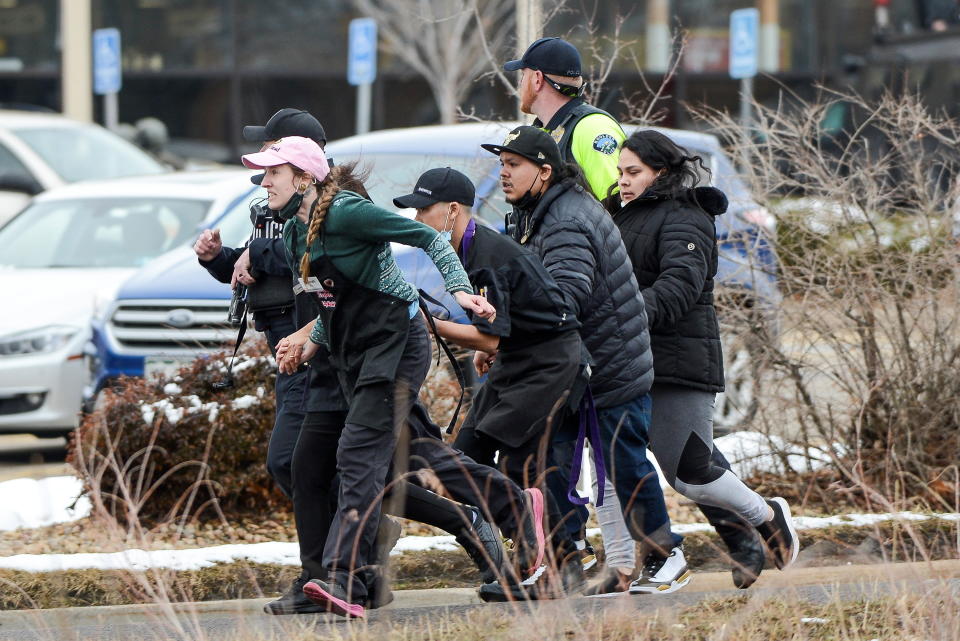 King Soopers employees being led away from an active shooter at the grocery store on Monday.  (Photo: MICHAEL CIAGLO/USA TODAY NETWORK/REUTERS)