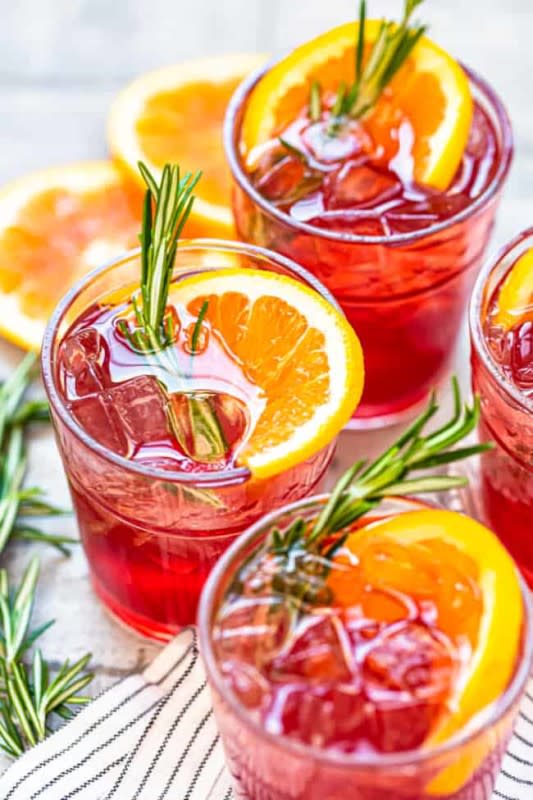 <p>The Cookie Rookie</p><p>Easy and quick to make, Thanksgiving calls for a warming drink filled with flavors of tart cranberry and zesty orange.</p><p><strong>Get the recipe: <a href="https://www.thecookierookie.com/orange-cranberry-bourbon-smash/" rel="nofollow noopener" target="_blank" data-ylk="slk:Orange Cranberry Bourbon Smash;elm:context_link;itc:0;sec:content-canvas" class="link ">Orange Cranberry Bourbon Smash</a></strong></p>