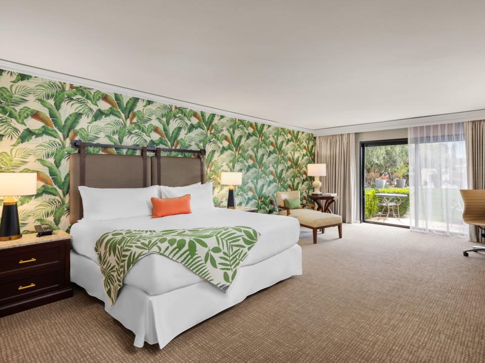 guest room at Tommy Bahama Miramonte Resort and Spa with bold wallpaper