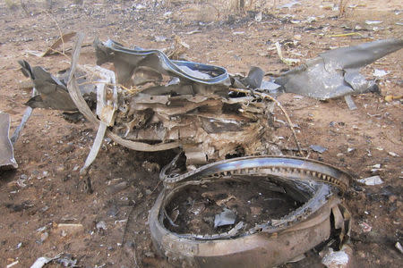 Debris is seen at the crash site of Air Algerie flight AH5017 near the northern Mali town of Gossi, July 24, 2014. REUTERS/Burkina Faso Military/Handout via Reuters