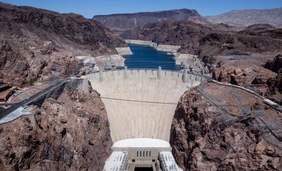 A high water mark is visible on the shoreline of Lake Mead at Hoover Dam.