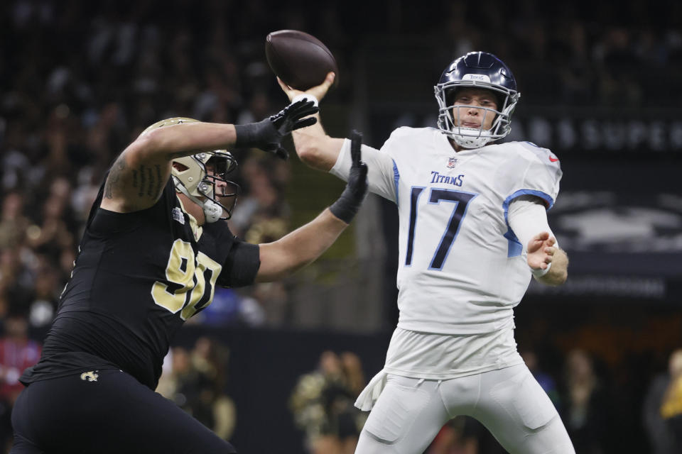New Orleans Saints defensive tackle Bryan Bresee, left, pressures Tennessee Titans quarterback Ryan Tannehill (17) in the first half of an NFL football game in New Orleans, Sunday, Sept. 10, 2023. (AP Photo/Butch Dill)