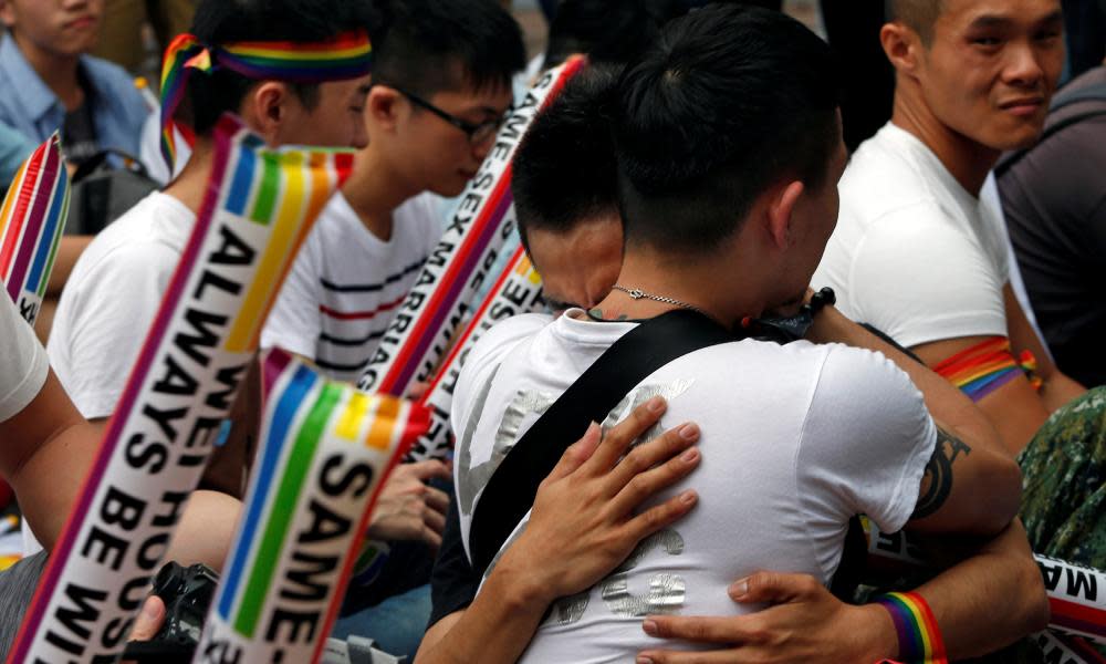 Supporters hug after Taiwan’s constitutional court ruled that same-sex couples have the right to legally marry