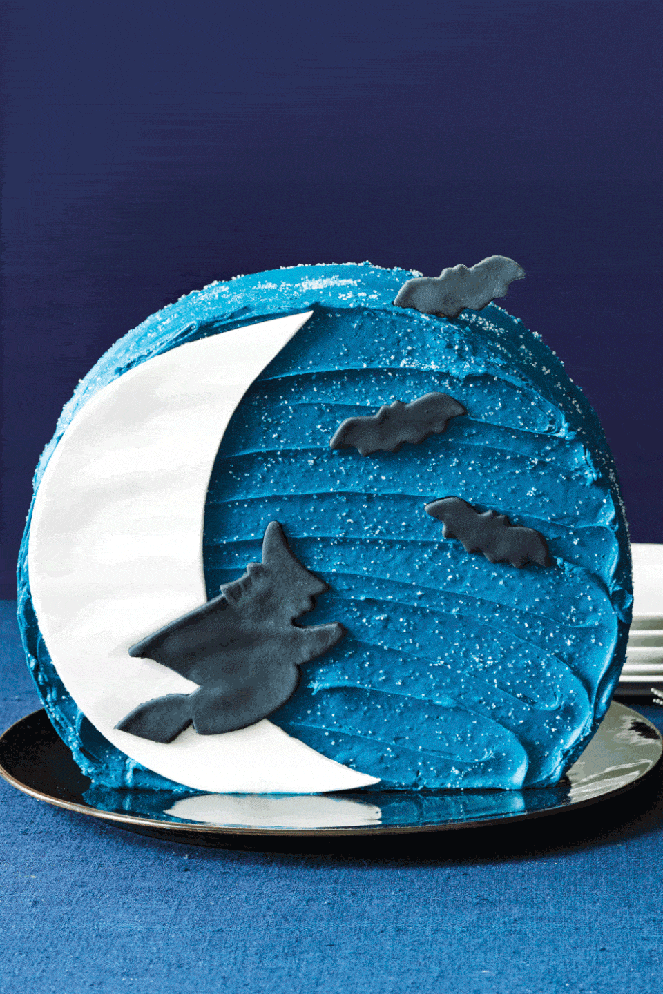<p>This deep blue icing hides a pound cake with creamy vanilla frosting inside.</p><p><a href="https://www.womansday.com/food-recipes/food-drinks/recipes/a11285/moon-cake-recipe-122731/" rel="nofollow noopener" target="_blank" data-ylk="slk:Get the Moon Cake recipe.;elm:context_link;itc:0;sec:content-canvas" class="link "><strong><em>Get the Moon Cake recipe. </em></strong> </a></p>