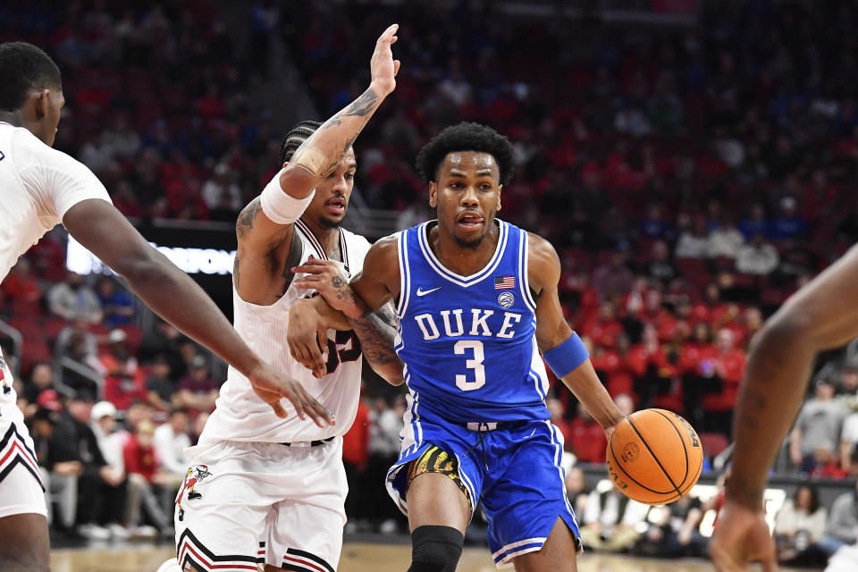 Duke guard Jeremy Roach (3) attempts to get pst Louisville guard Skyy Clark (55) during the first half of an NCAA college basketball game in Louisville, Ky., Tuesday, Jan. 23, 2024. (AP Photo/Timothy D. Easley)