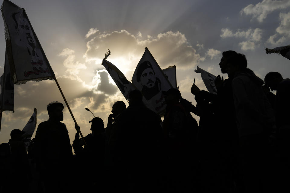 Protesters gather in Tahrir Square in Baghdad, Iraq, Friday, Feb. 3, 2023. As the Iraqi currency continued its slide, some 150 protesters gathered Friday in central Baghdad, call on the government to take action to stop the crisis. (AP Photo/Hadi Mizban)