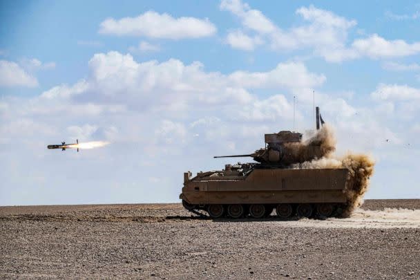 FILE PHOTO: In this file photo taken on March 25, 2022, a U.S. Bradley Fighting Vehicle (BFV) fires an AGM-114 Hellfire during a heavy-weaponry military exercise in the countryside of Deir ez-Zor province in eastern Syria. (Delil Souleiman/AFP via Getty Images, File)