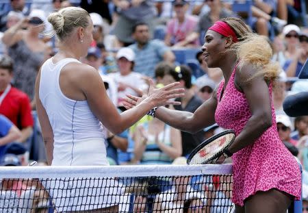 Serena Williams (R) of the U.S. is congratulated on her win by Kaia Kanepi of Estonia at the 2014 U.S. Open tennis tournament in New York, September 1, 2014. REUTERS/Ray Stubblebine