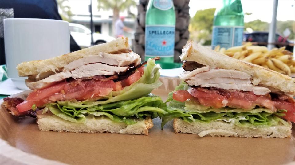 The Overton's Turkey club sandwich with house brined turkey, bacon, crisp iceberg, tomato and house mayo.