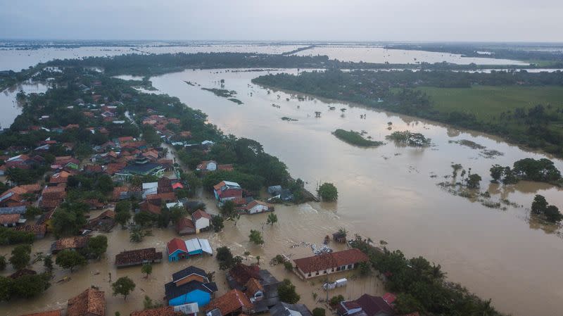 An aerial view shows a residential area affected by floods, which damaged the embankment of the Citarum river following the heavy rains, in Bekasi