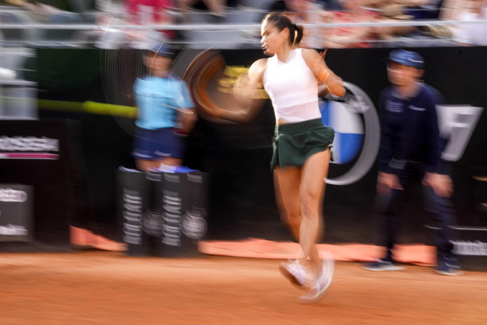 Emma Raducanu returns the ball to Bianca Andreescu during their match at the Italian Open tennis tournament, in Rome, Tuesday, May 10, 2022. (AP Photo/Andrew Medichini)