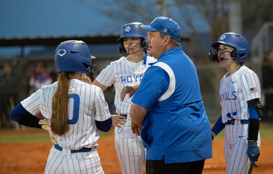 Royals head coach Brian Watson talks with his players during a timeout in the Pace vs Jay softball game at Jay High School on Thursday, March 24, 2022.