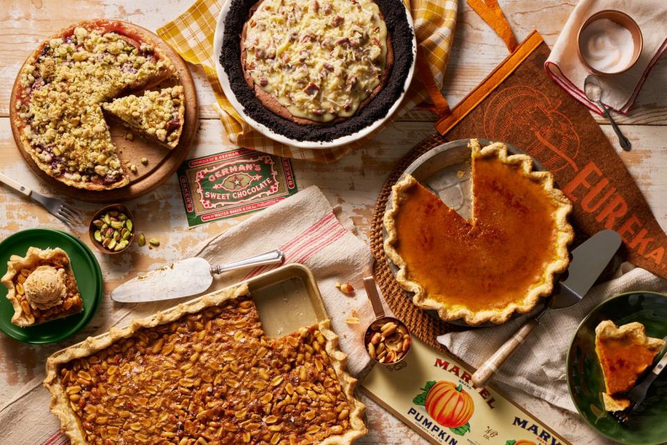 pie assortment including fresh fig tart with pistachio crumble, peanut salted caramel slab pie, and brûléed pumpkin pie