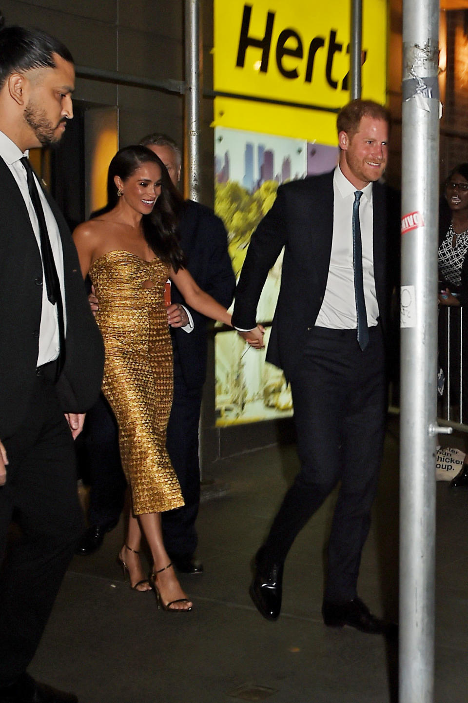 <p>Despite the chaos of fans and security, Markle and Harry both smiled as they walked out. </p>