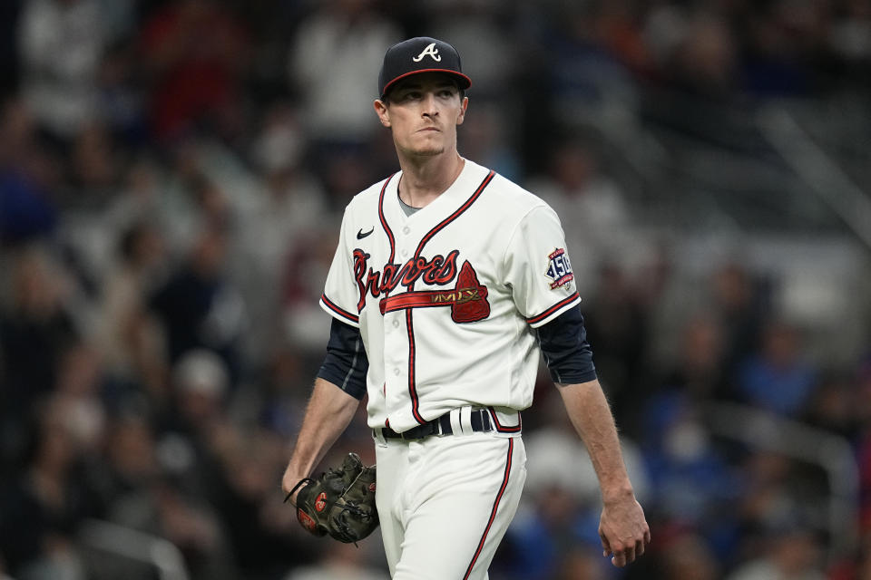 Atlanta Braves pitcher Max Fried walks to the dugout during the fourth inning in Game 1 of baseball's National League Championship Series against the Los Angeles Dodgers Saturday, Oct. 16, 2021, in Atlanta. (AP Photo/Ashley Landis)