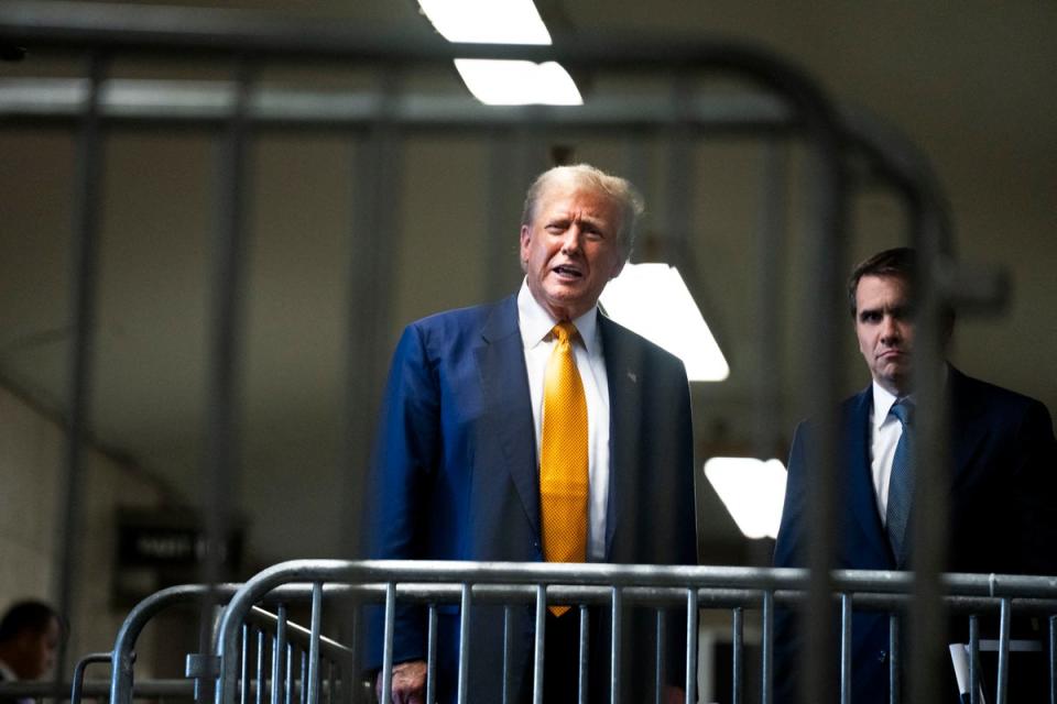 Donald Trump speaks to reporters at the end of the day of his criminal trial on 2 May (POOL/AFP via Getty Images)