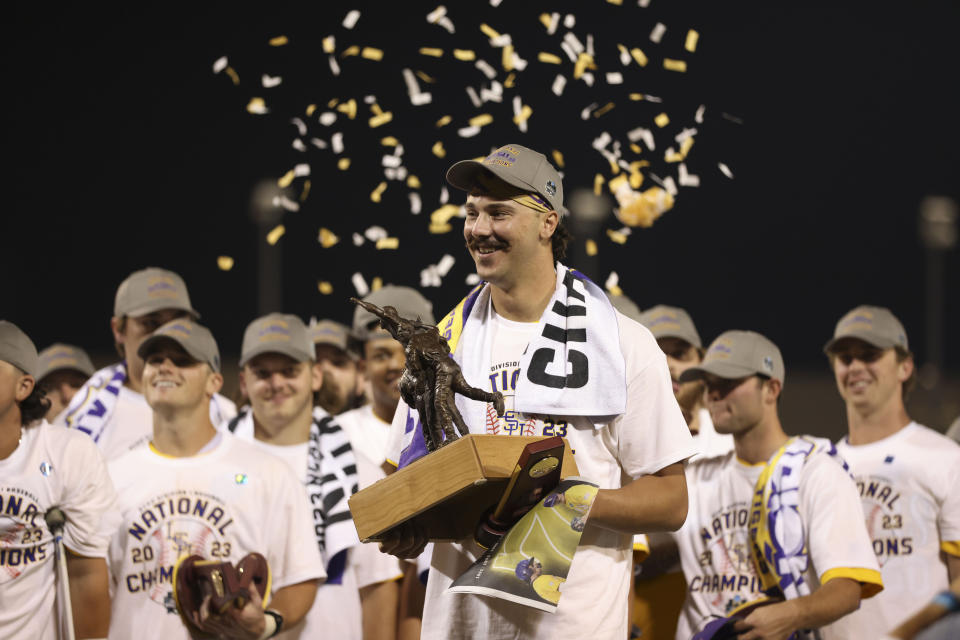 LSU pitcher Paul Skenes holds his MVP trophy as he celebrates their win over Florida in Game 3 of the NCAA College World Series baseball finals in Omaha, Neb., Monday, June 26, 2023. LSU won the national championship 18-4. (AP Photo/Rebecca S. Gratz)