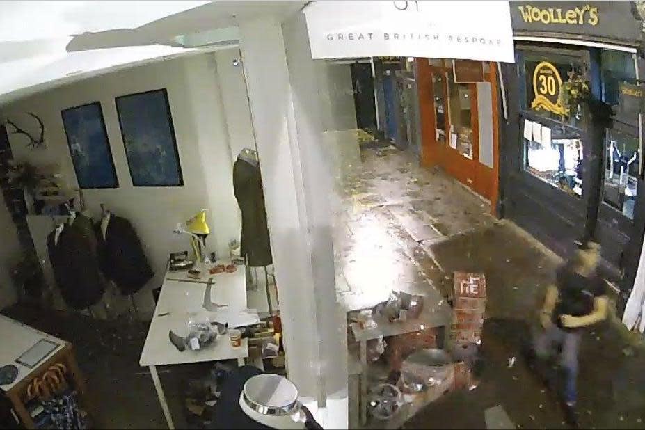 CCTV of a Vespa being knocked over by a thug