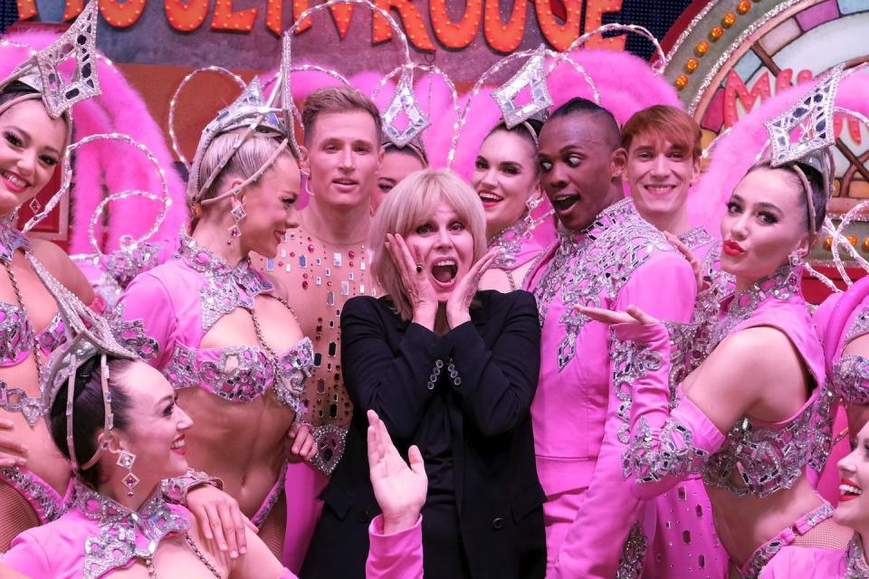 paris, france october 13 joanna lumley poses with performers at le moulin rouge as she films a new series for itv at le moulin rouge on october 13, 2021 in paris, france photo by laurent viteurgetty images