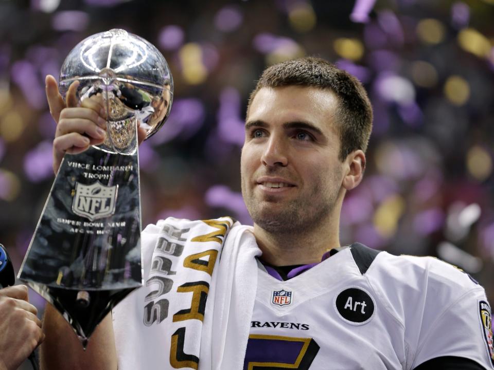 FILE - In this Feb. 13, 2013 file photo, Baltimore Ravens quarterback Joe Flacco (5) holds the Vince Lombardi Trophy after defeating the San Francisco 49ers 34-31 in the NFL Super Bowl XLVII football game in New Orleans. Flacco was the Super Bowl MVP and the NFL's highest-paid quarterback just a few years ago. After injuries shortened his last two seasons, Flacco is now in New York with a new role: as a backup to Sam Darnold.  (AP Photo/Matt Slocum, File)