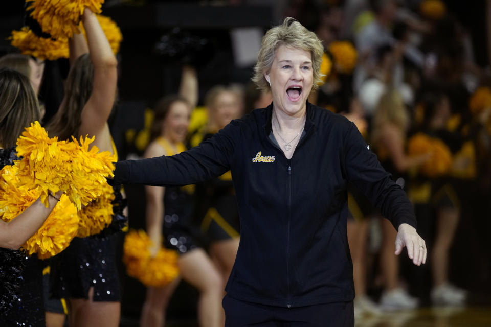 Iowa head coach Lisa Bluder walks onto the court during an Iowa women's basketball team celebration, Wednesday, April 10, 2024, in Iowa City, Iowa. Iowa lost to South Carolina in the Final Four college basketball championship game of the women's NCAA Tournament on Sunday. (AP Photo/Charlie Neibergall)