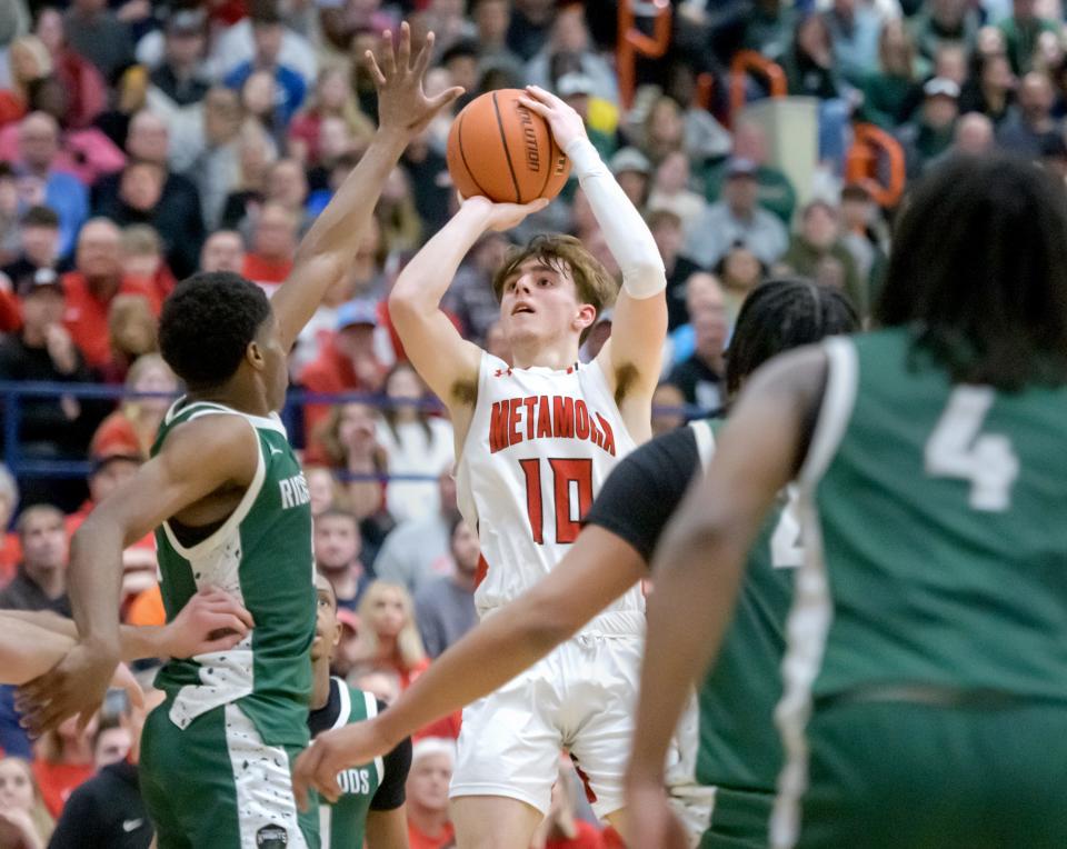 Metamora's Tyler Mason (10) lines up a three-pointer against Richwoods in the second half of their Class 3A boys basketball sectional title game Friday, March 1, 2024 at Pontiac High School. The Knights upset the defending champion Redbirds 61-55.