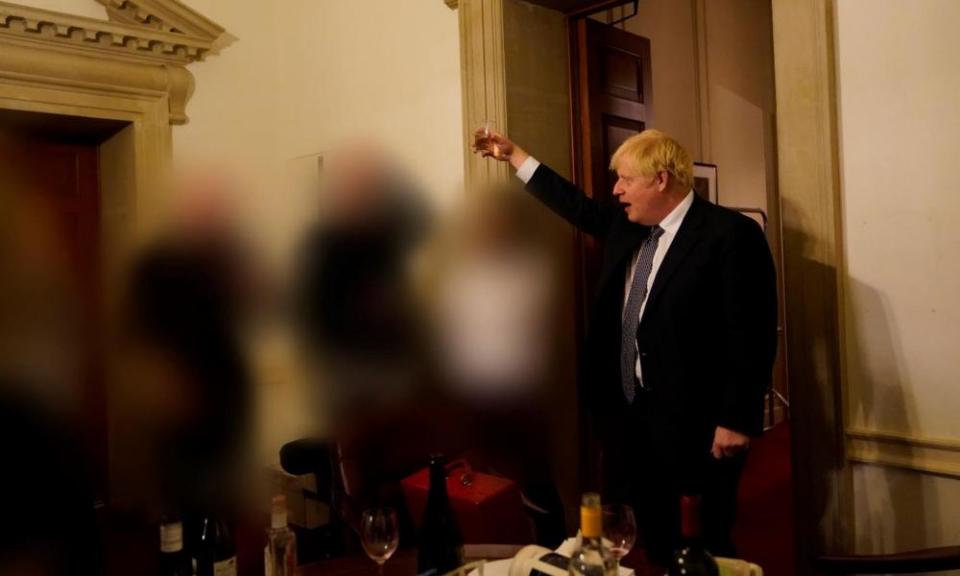 A photo taken on 13 November 2020 shows Johnson holding a drink during a gathering at No 10