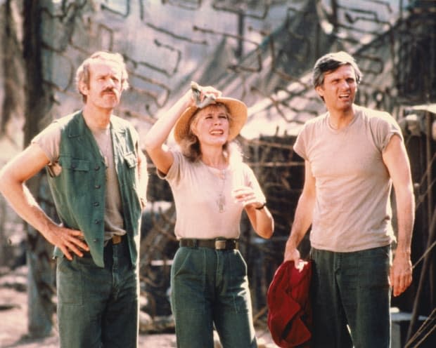 <em>Mike Farrell as Captain B.J. Hunnicutt, Loretta Swit as Margaret 'Hot Lips' Houlihan, and Alan Alda as Captain Benjamin Franklin 'Hawkeye' Pierce</em>, in a publicity still issued for the US television series 'M*A*S*H', USA, circa 1975. <p>Silver Screen Collection/Getty Images</p>