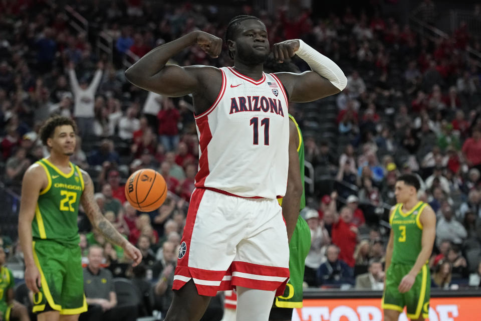 Arizona center Oumar Ballo (11) celebrates after a play against Oregon during the first half of an NCAA college basketball game in the semifinal round of the Pac-12 tournament Friday, March 15, 2024, in Las Vegas. (AP Photo/John Locher)