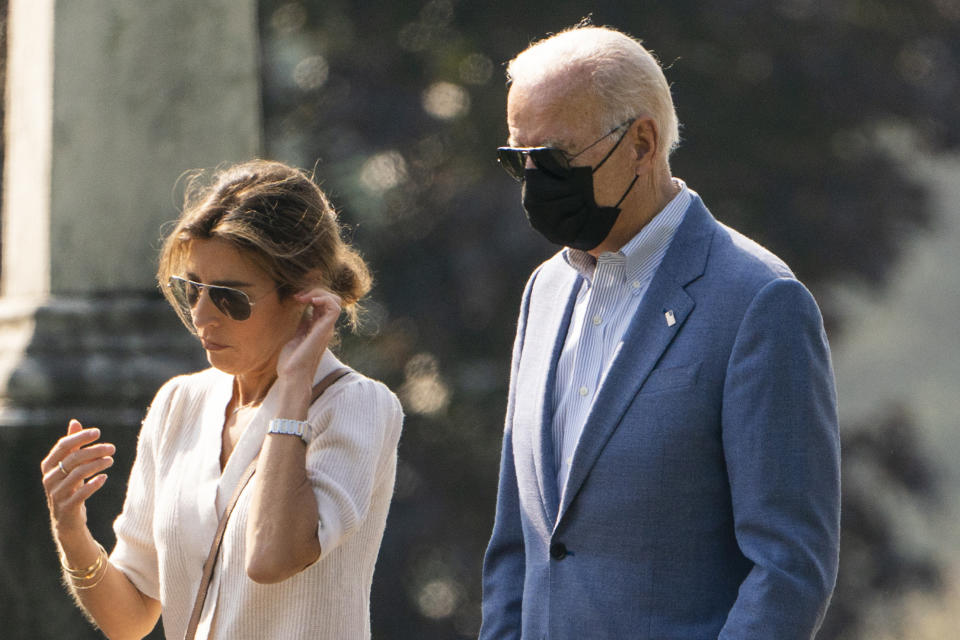 FILE - President Joe Biden leaves St. Joseph on the Brandywine Catholic Church in Wilmington, Del., with his daughter-in-law, Hallie Biden after attending a Mass, Sunday, Oct. 3, 2021. On Friday, Dec. 9, 2022, The Associated Press reported on stories circulating online incorrectly claiming Hallie Biden tweeted that former President Donald Trump won the 2020 election. (AP Photo/Manuel Balce Ceneta, File)
