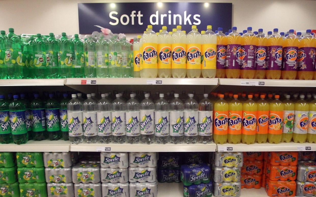 A shelf full of soft drinks