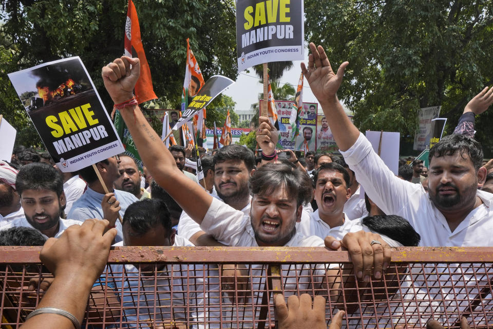 Members of the youth wing of India's Congress party shout slogans during a protest near Parliament House in New Delhi, India, Thursday, July 20, 2023. The protest was against deadly ethnic clashes in the country's northeast after a video showed two women being assaulted by a mob. The video triggered outrage across India and was widely shared on social media despite the internet being largely blocked in remote Manipur state. (AP Photo/Manish Swarup)