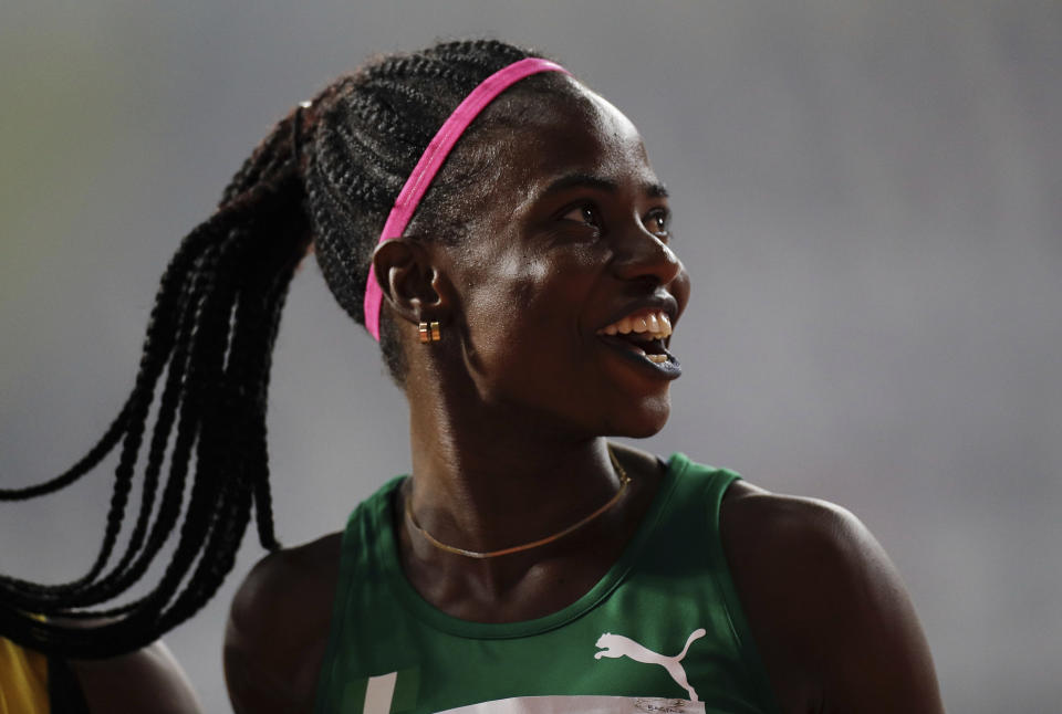 Tobi Amusan of Nigeria smiles after finishing a women's 100 meter hurdles heat at the World Athletics Championships in Doha, Qatar, Saturday, Oct. 5, 2019. (AP Photo/Petr David Josek)