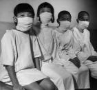 Caption from LIFE. "Hiroshima's children patiently wait their turn for a complete and detailed physical examination in ABCC's [Atom Bomb Casualty Commission] temporary laboratory clinic." (Carl Mydans—Time & Life Pictures/Getty Images) <br> <br> <a href="http://life.time.com/history/carl-mydans-hiroshima/#1" rel="nofollow noopener" target="_blank" data-ylk="slk:Click here;elm:context_link;itc:0;sec:content-canvas" class="link ">Click here</a> to see the full collection at LIFE.com