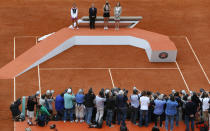 Russia's Maria Sharapova (2ndR) and Italy's Sarah Errani (L) pose with her trophies near former tennis champion Monica Seles (R) and President of French Tennis Federation Jean Gachassin (L) on the podium after their Women's Singles final tennis match of the French Open tennis tournament at the Roland Garros stadium, on June 9, 2012 in Paris. Sharapova won the final. AFP PHOTO / KENZO TRIBOUILLARDKENZO TRIBOUILLARD/AFP/GettyImages