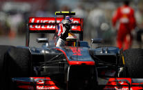 MONTREAL, CANADA - JUNE 10: Lewis Hamilton of Great Britain and McLaren celebrates with the British flag after winning the Canadian Formula One Grand Prix at the Circuit Gilles Villeneuve on June 10, 2012 in Montreal, Canada. (Photo by Vladimir Rys/Getty Images)