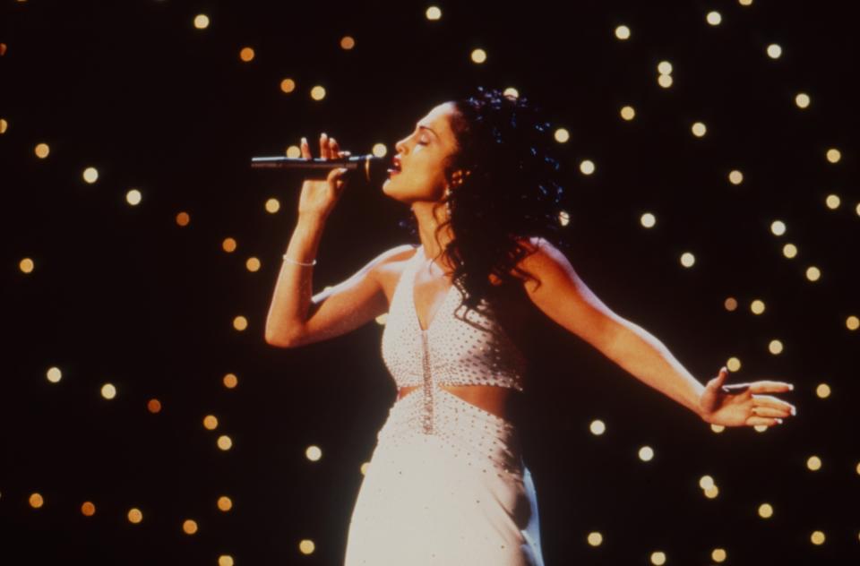 Jennifer Lopez onstage singing as Selena