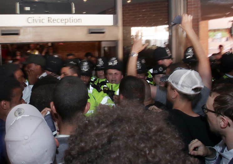 Protesters try to enter Kensington town hall in west London, the headquarters of the Royal Borough of Kensington and Chelsea, demanding answers over the Grenfell Tower disaster.