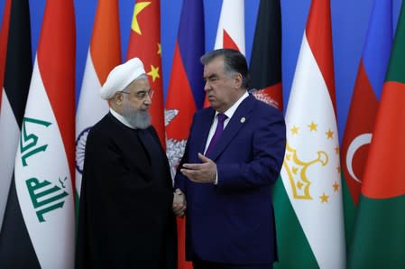 Iranian President Rouhani attends a meeting with his Tajik counterpart Rahmon in Dushanbe