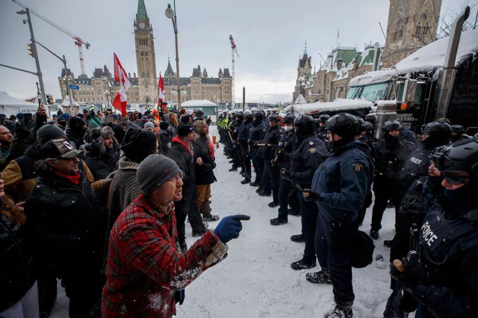 Police move in to clear downtown Ottawa of protesters after weeks of demonstrations on Feb. 19, 2022.