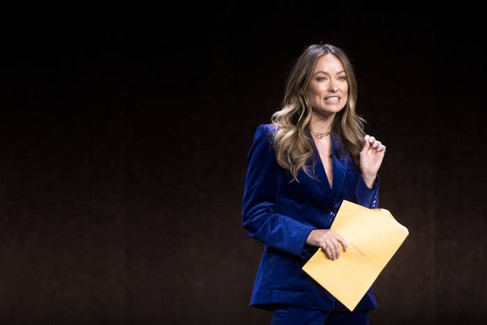 Olivia Wilde holding an envelope