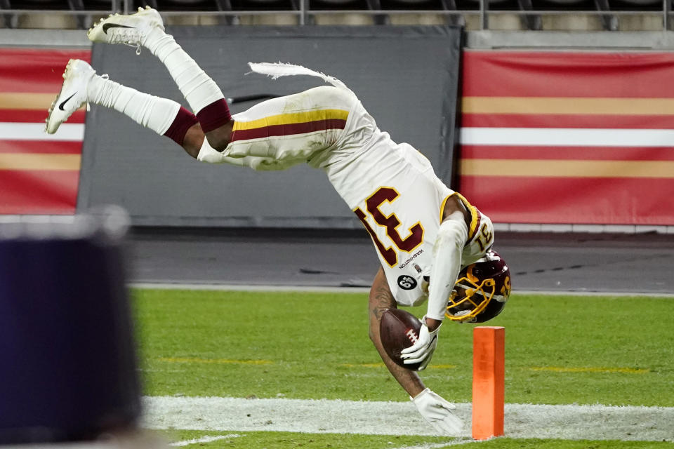 Washington Football Team strong safety Kamren Curl (31) dives into the end zone for a touchdown after an interception against the San Francisco 49ers during the second half of an NFL football game, Sunday, Dec. 13, 2020, in Glendale, Ariz. (AP Photo/Rick Scuteri)