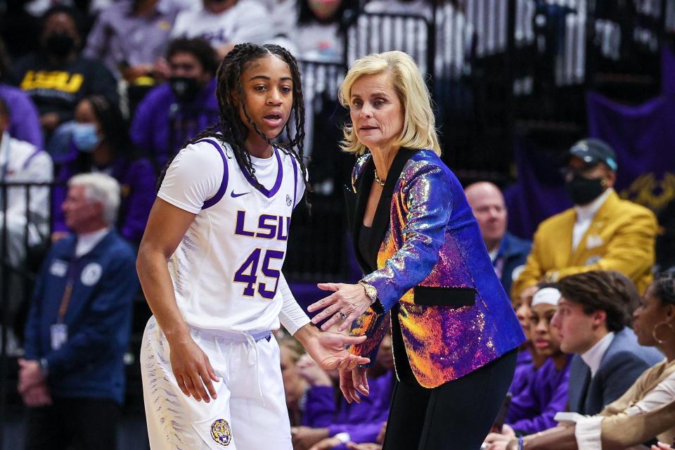 LSU coach Kim Mulkey, left, talks to guard Alexis Morris (45) during a timeout in the No. 16 Tigers' loss to No. 1 South Carolina on Thursday night at the PMAC.