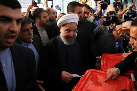 Iranian President Hassan Rouhani casts his vote during the presidential election in Tehran, Iran, May 19, 2017. TIMA via REUTERS