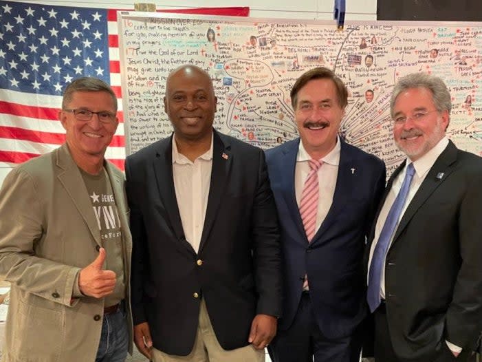 Former Trump National Security Advisor Mike Flynn posted a photo on Telegram of himself posing with other in front of a bizarre whiteboard filled with names and arrows.  (Mike Flynn / Telegram)
